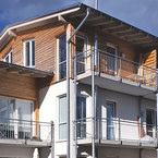 Mehrfamilienhaus in Grünwald als Holzsystembau von SÄBU Holzbau